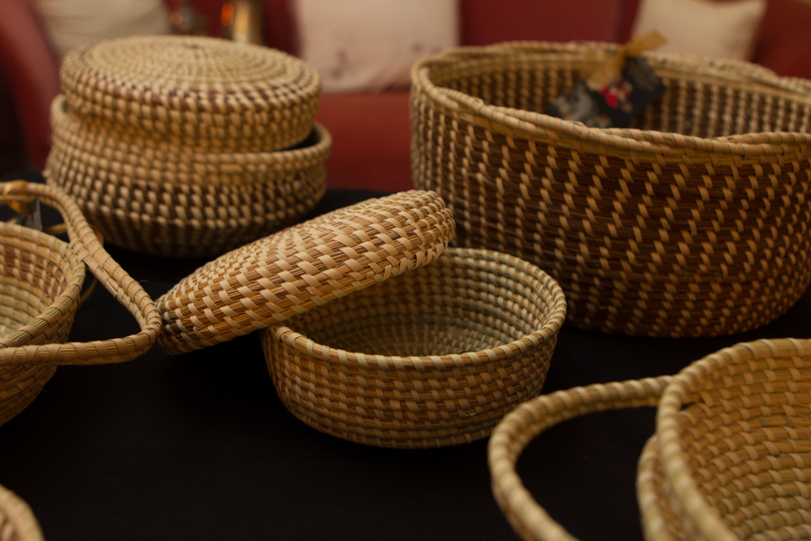 Close-up of lidded and open coiled sweetgrass baskets
