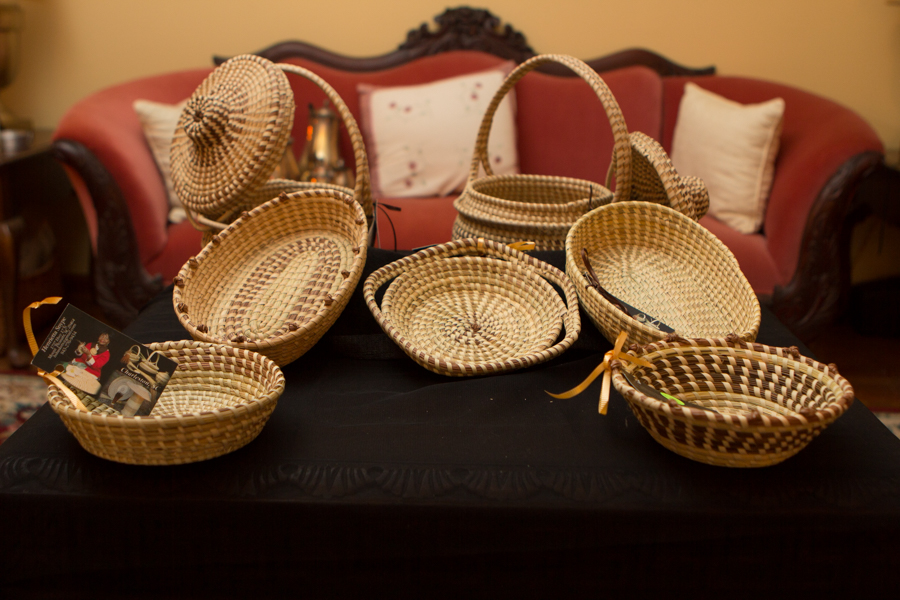 A table of sweetgrass bread baskets, trays, and cover baskets