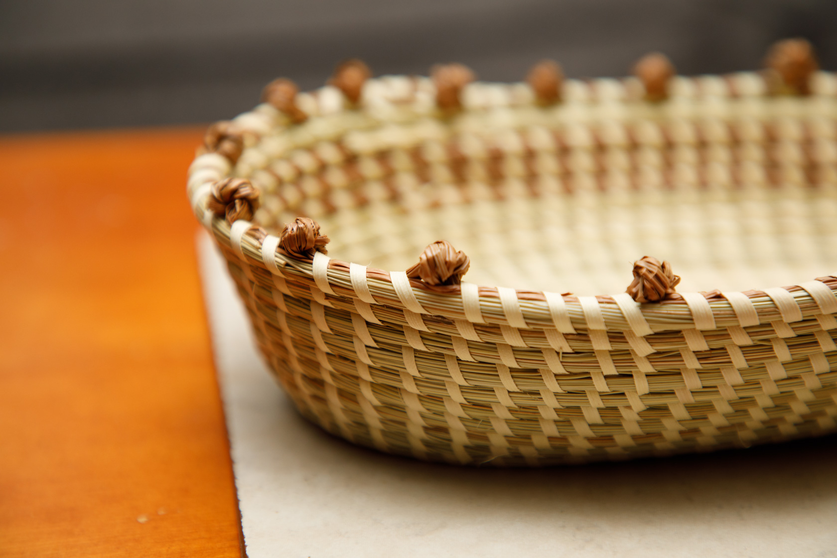 Oval sweetgrass bread basket with knotted rim